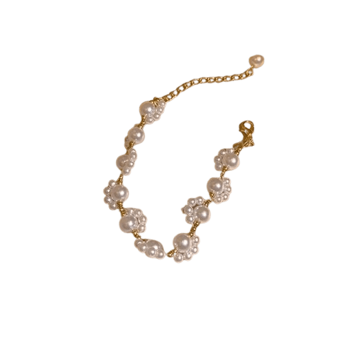 Alam Ara cute minimalist imitation pearl bracelet with golden-tone accents and tassel charm, front view