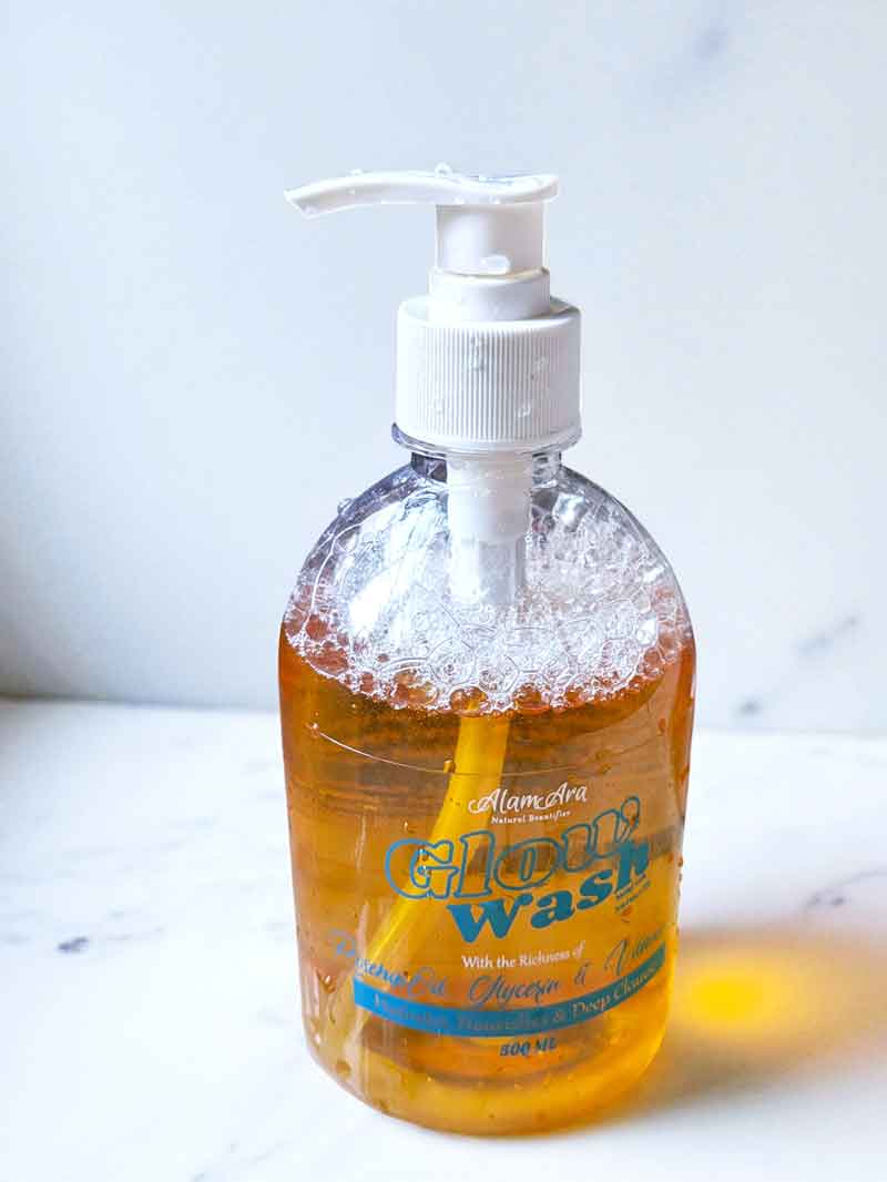 A simple, elegant bottle of Alam Ara's Glow Wash natural liquid handwash, showcasing the product packaging.