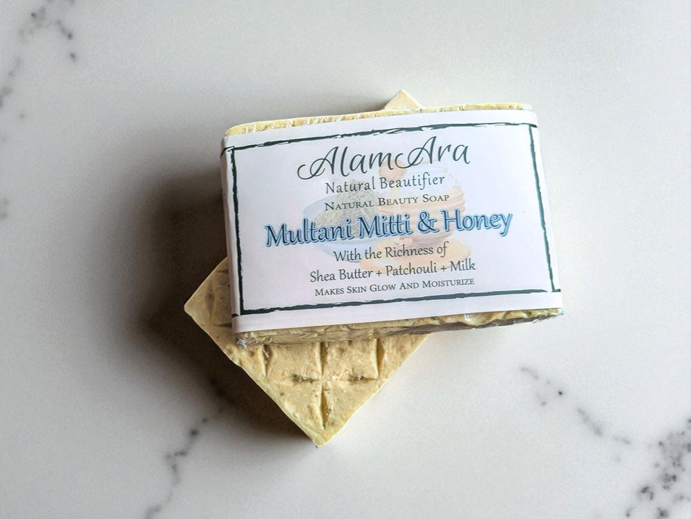  Close-up view of the purifying Multani Mitti soap bar, handmade in Pakistan.