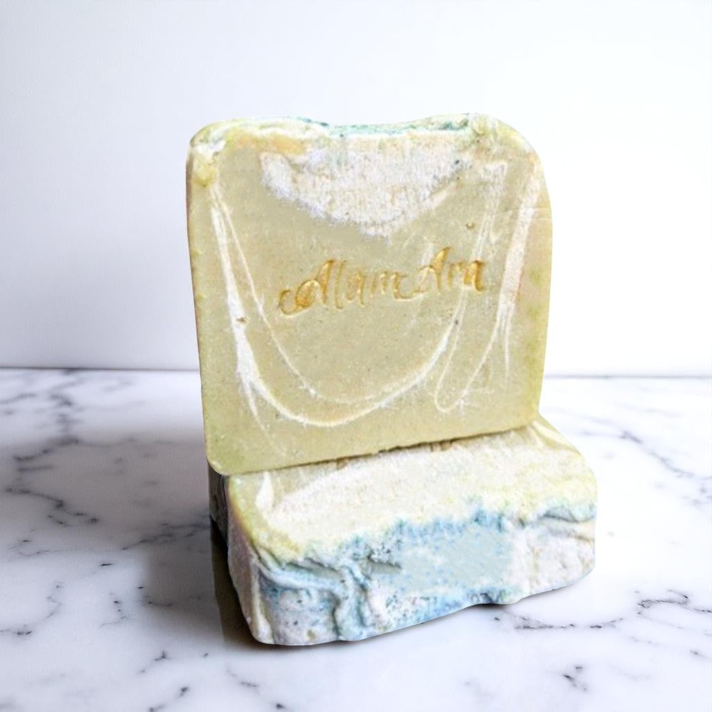 Textured image of Alamara natural peppermint soap with green clay, rosemary, and cooling effect
