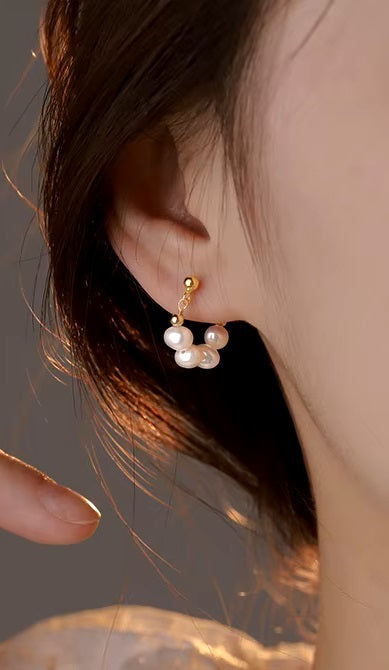 Woman wearing Alam Ara Baroque freshwater pearl 14K gold plated drop earrings, elegant style