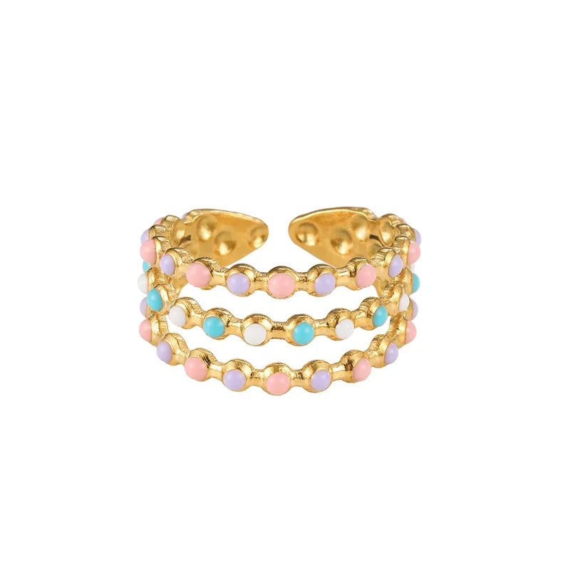 Close up of colorful enamel inlays on 18K gold plated stainless steel Bohemian ring