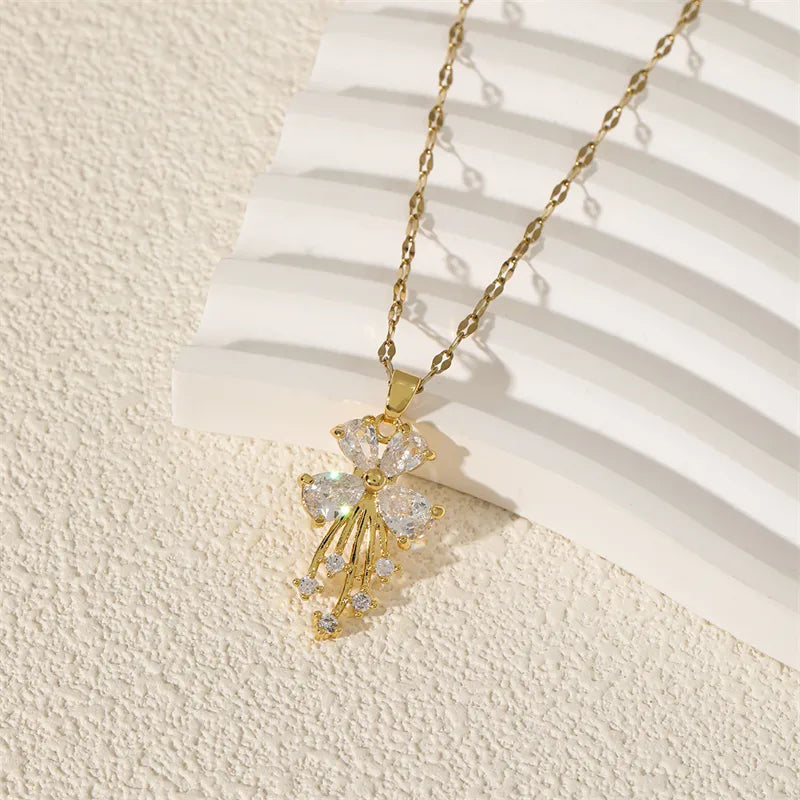 Close up of sparkling zircon crystals and golden blossom design on pendant necklace