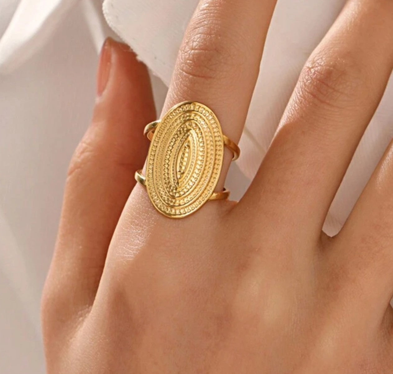 Woman wearing elegant classic geometric leaf open ring, showing adjustable fit for daily wear