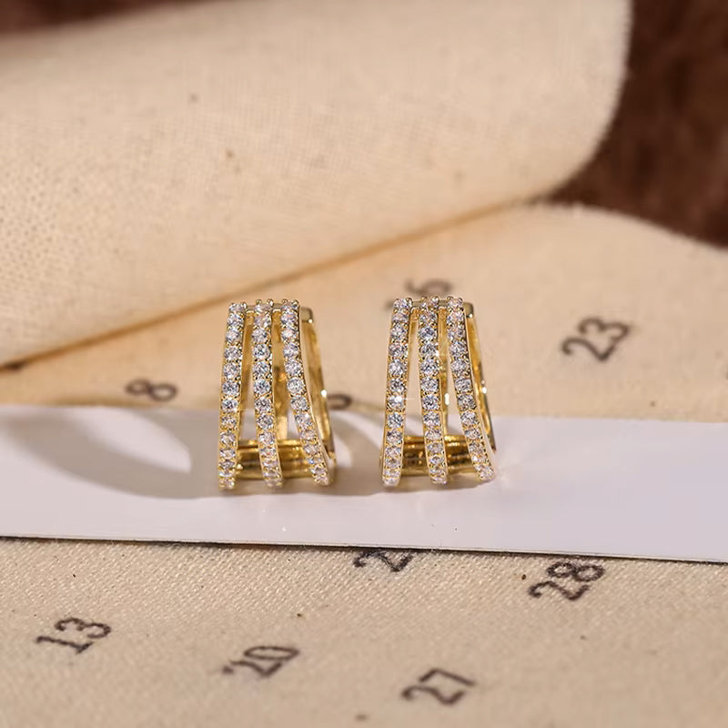 Side view of exquisite luxury gold color zircon hoop earrings, highlighting craftsmanship