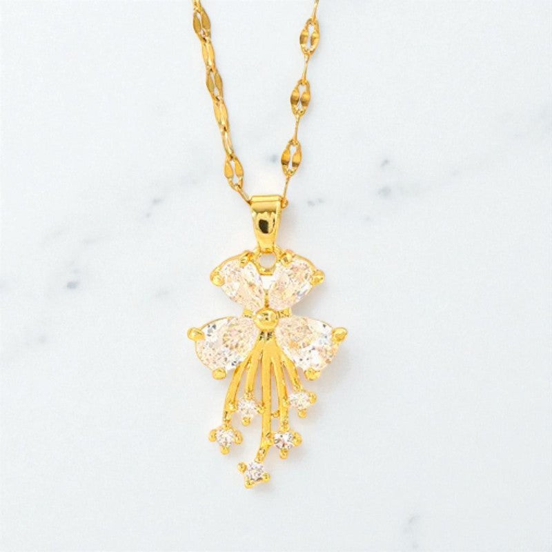 Side view of exquisite golden blossom crystal pendant necklace, showing stainless steel chain
