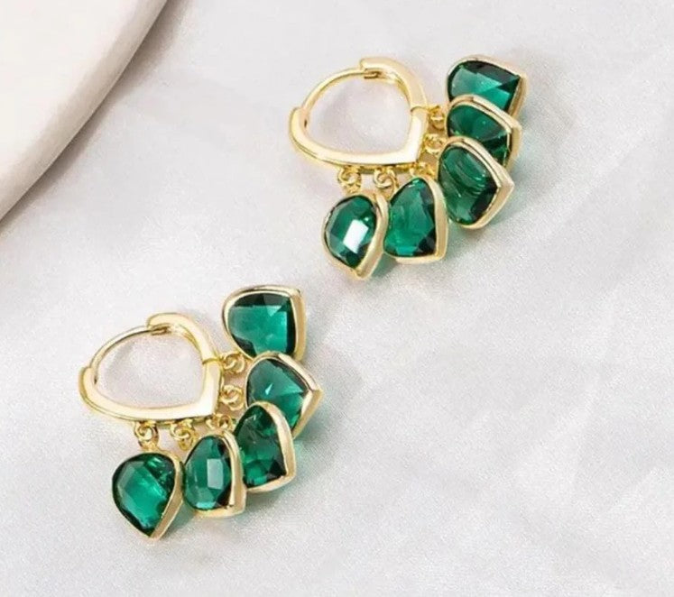 Side view of elegant golden green crystal hoop earrings, showing craftsmanship