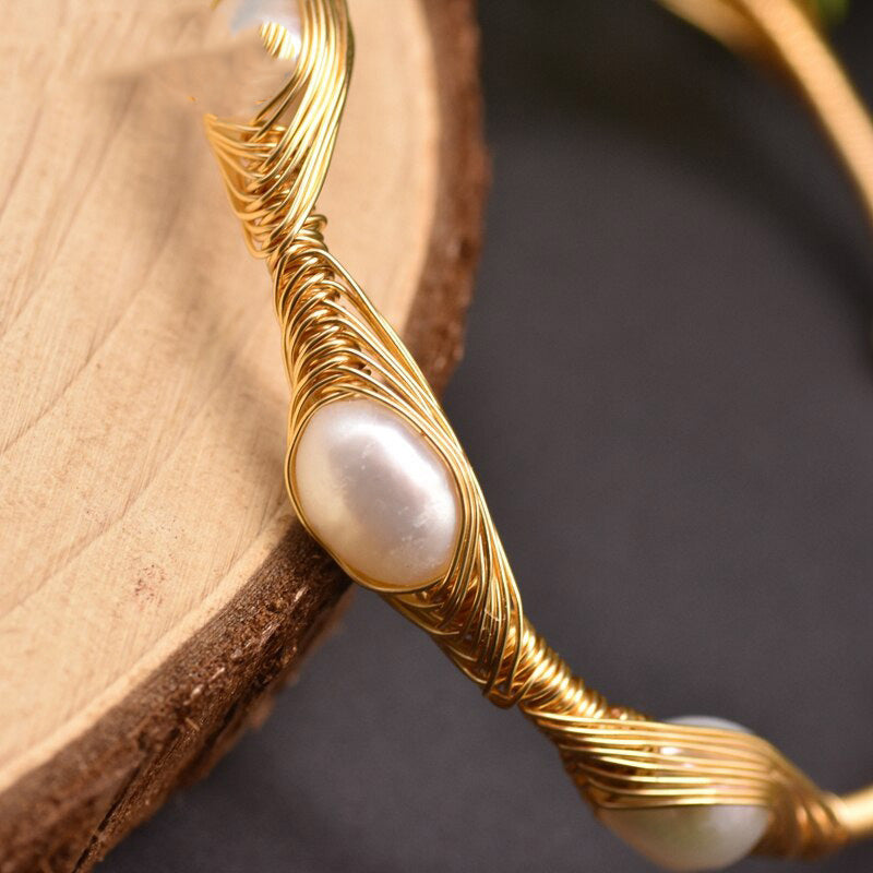 Close up of intricate handwired detail and unique Baroque freshwater pearl shapes on open bangle cuff