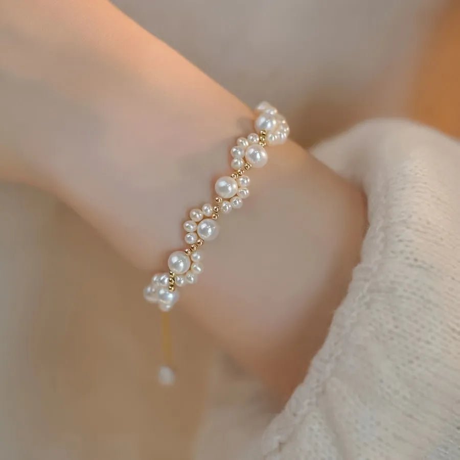 Woman wearing cute minimalist imitation pearl bracelet with golden-tone tassel, showing elegant daily wear in Pakistan