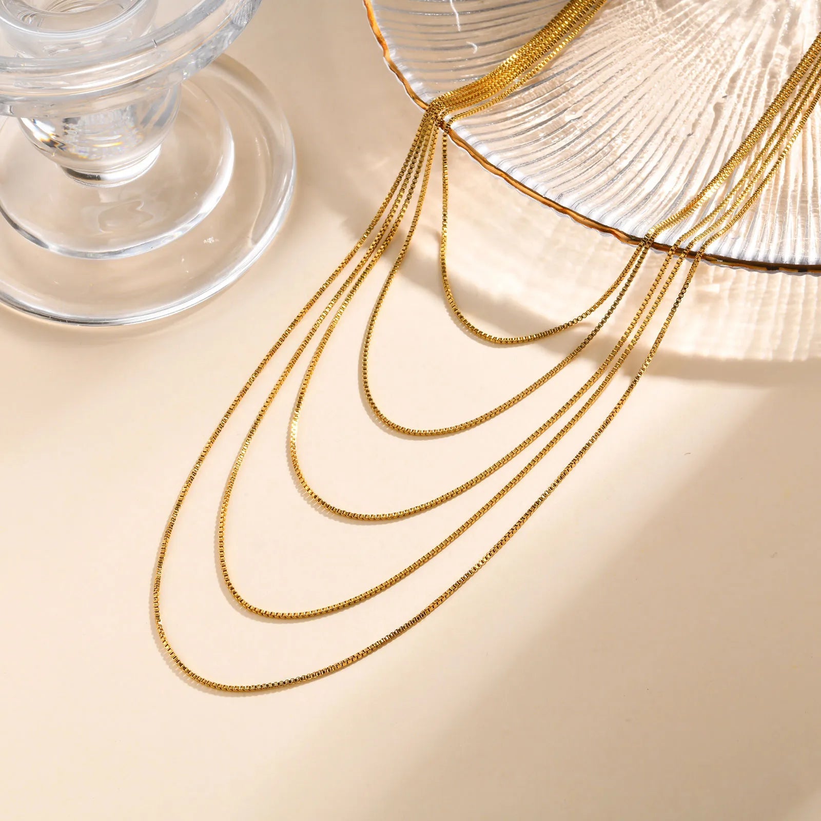 Close up of delicate chains and adjustable clasp on multi layer necklace