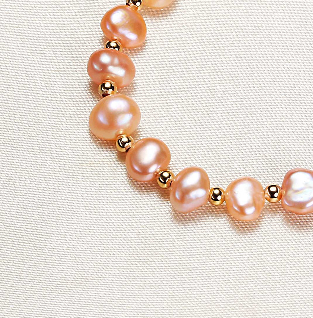 Close up of unique natural Baroque freshwater pearls on simple design bracelet