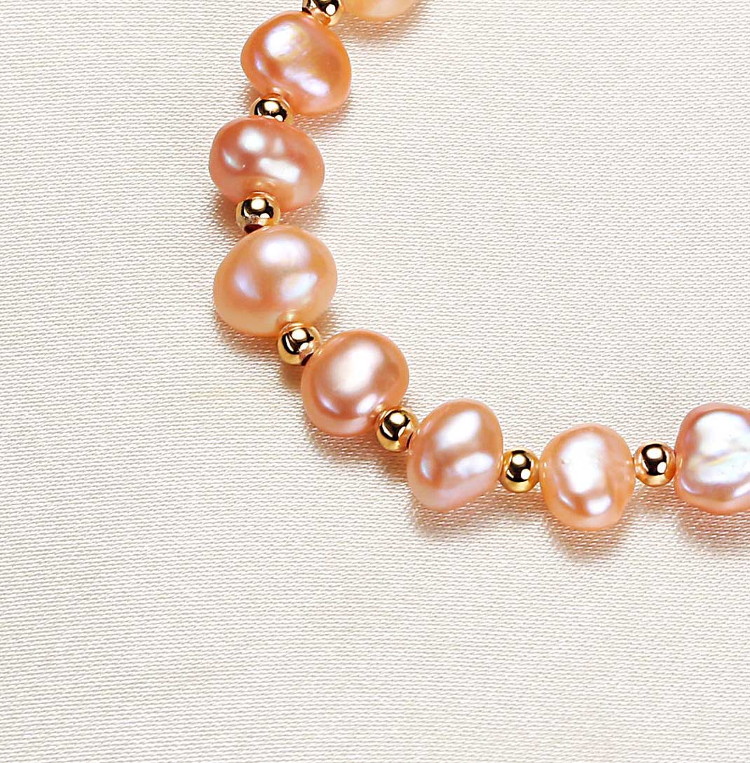 Close up of unique natural Baroque freshwater pearls on simple design bracelet