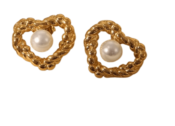 Woman wearing charming 18K retro twist pearl heart studs, showing elegant daily wear in Pakistan