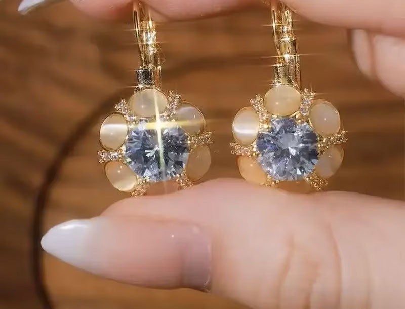 Side view of exquisite white opal earrings, highlighting unique design and quality