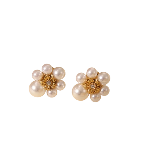 Close up of lustrous pearl and shimmering zircon crystal on stud earrings